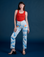 Alex is 5’8” and wearing XXS Work Pants in Sunny Cloud Airbrush paired with a mustang red Tank Top