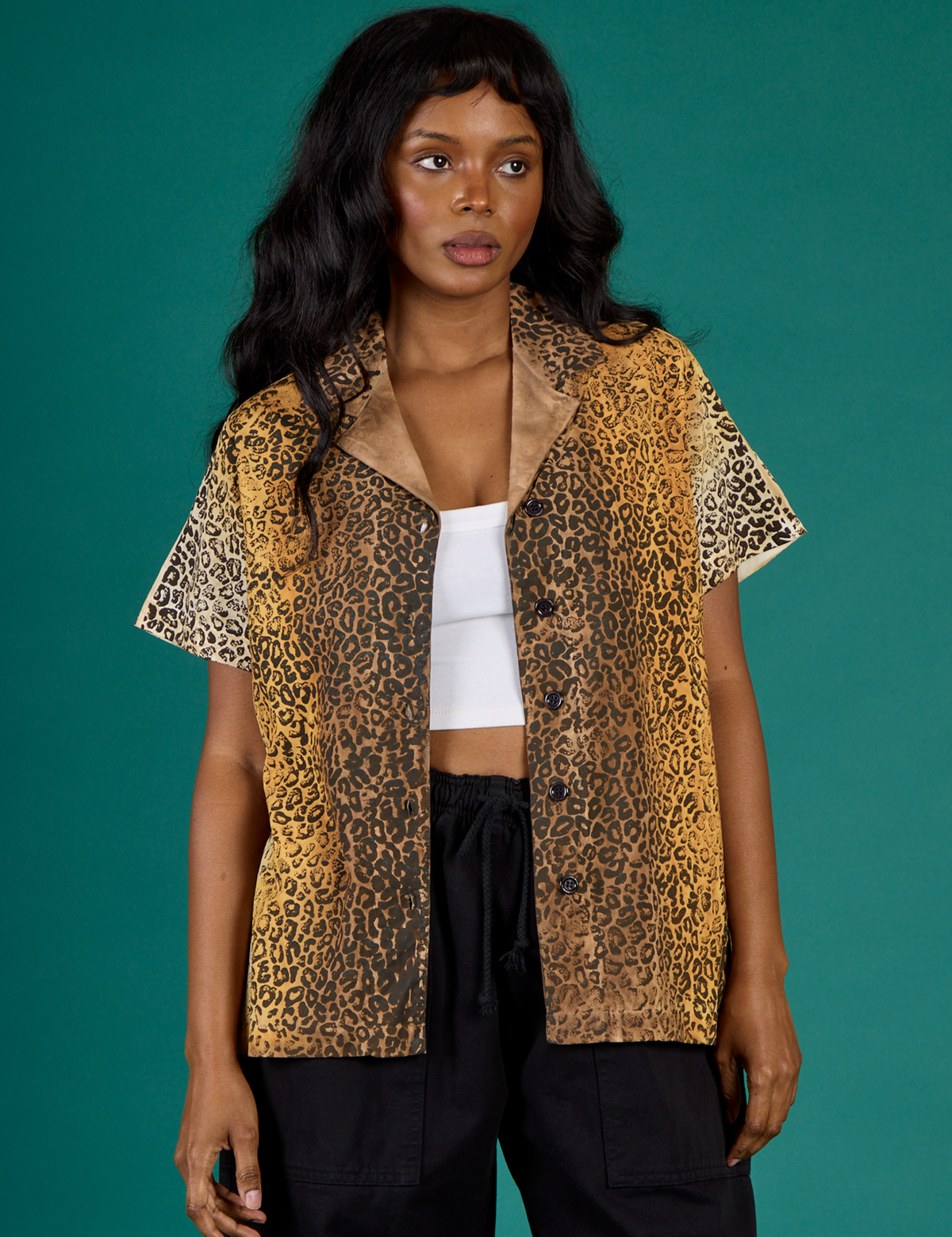 Kandia is 5'3" and wearing XXS Leopard Pantry Button Up