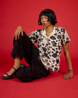Kira is 5'10" and wearing XXS Cow Pantry Button Up
