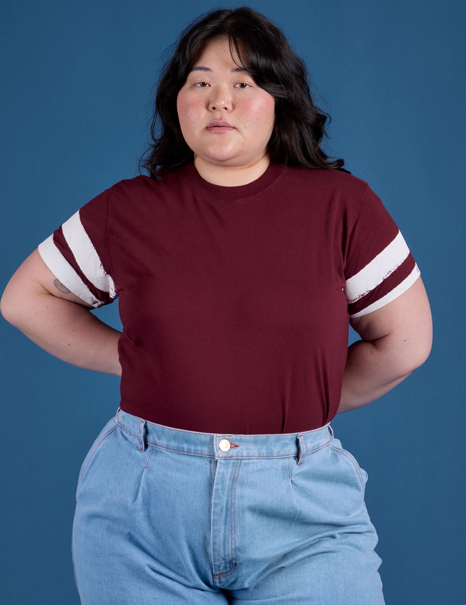 Ashley is 5’7” and wearing L Painted Vintage Tee in Red Wine