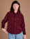 Alex is 5'8" and wearing P Cropped Corduroy Overshirt in Red Wine