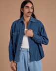 Anthony is 5'6" and wearing S Cropped Corduroy Overshirt in French Blue