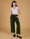 Alex is 5’8” and wearing XXS Corduroy Drop Pocket Cargo Pants in Evergreen paired with a Cropped Tank in Vintage Tee White
