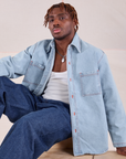 Issac is wearing Denim Overshirt in Light Wash