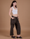 Alex is 5’8” and wearing XXS Drop Pocket Cargo Pants in Espresso Brown paired with a vintage tee white Cropped Tank