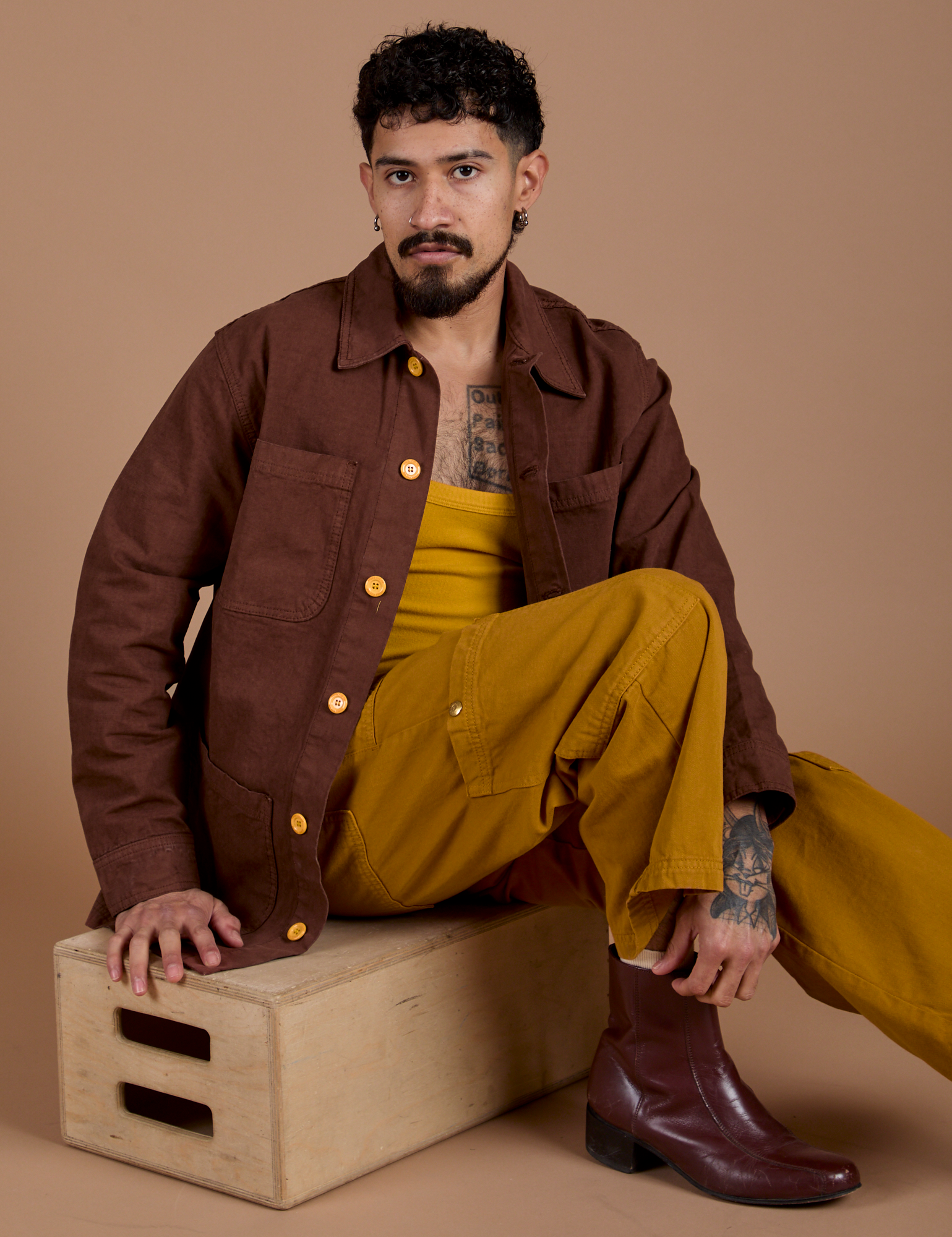 Jesse is wearing Ripstop Field Coat in Fudgesicle Brown