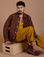 Jesse is wearing Ripstop Field Coat in Fudgesicle Brown