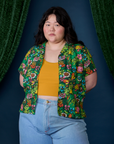 Ashley is 5'7" and wearing L Pond Party Pantry Button-Up