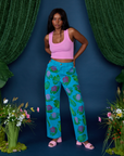 Kandia is 5'3" and wearing XS Paintstamped Work Pants in Lilypad paired with bubblegum pink Cropped Tank