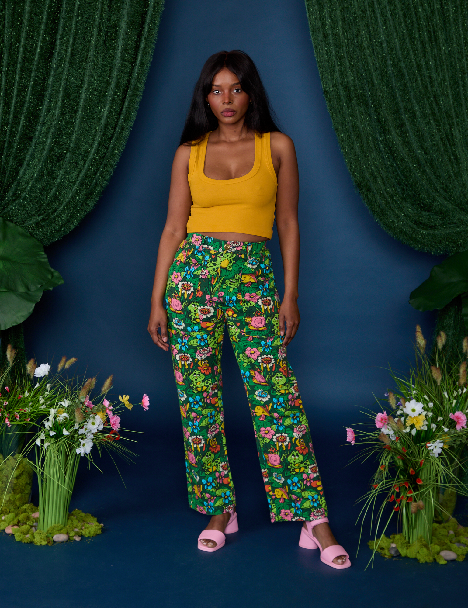 Kandia is 5'3" and wearing XS Work Pants in Pond Party paired with mustard yellow Cropped Tank