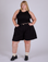Juliet is 5’7” and wearing 2XL Pleated Trouser Shorts in Basic Black paired with black Racerback Tank