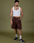 Jesse is 5’8” and wearing S Longline Work Shorts in Fudgesicle Brown paired with vintage tee white Cropped Tank
