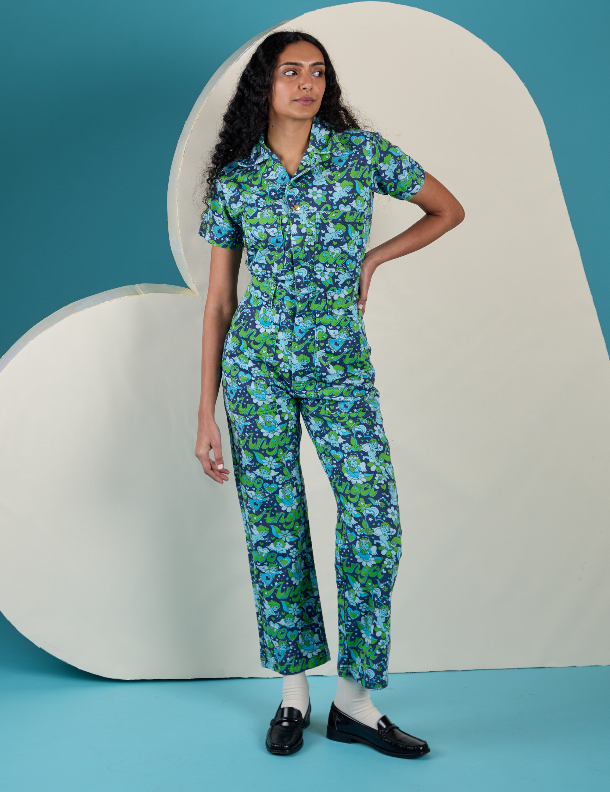 Shahana is 5’10 and wearing XS is wearing Angel Print Jumpsuit