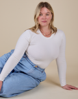 Lish is wearing Long Sleeve Baby Tee in Vintage Tee Off-White