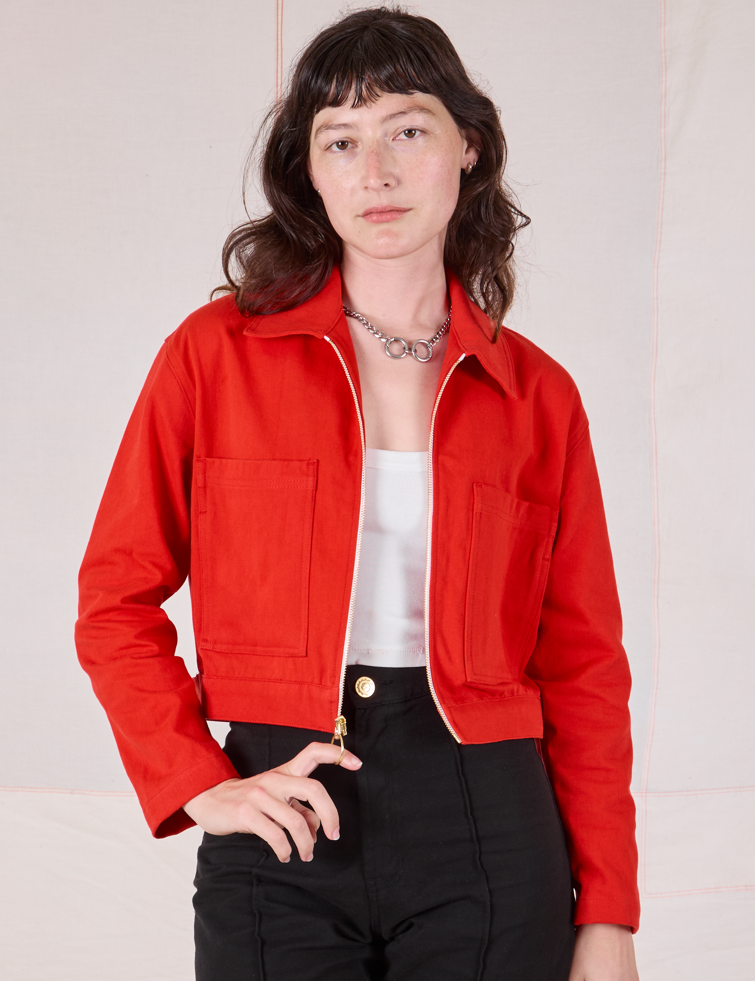Alex is 5’8” and wearing P Mechanic Jacket in Mustang Red