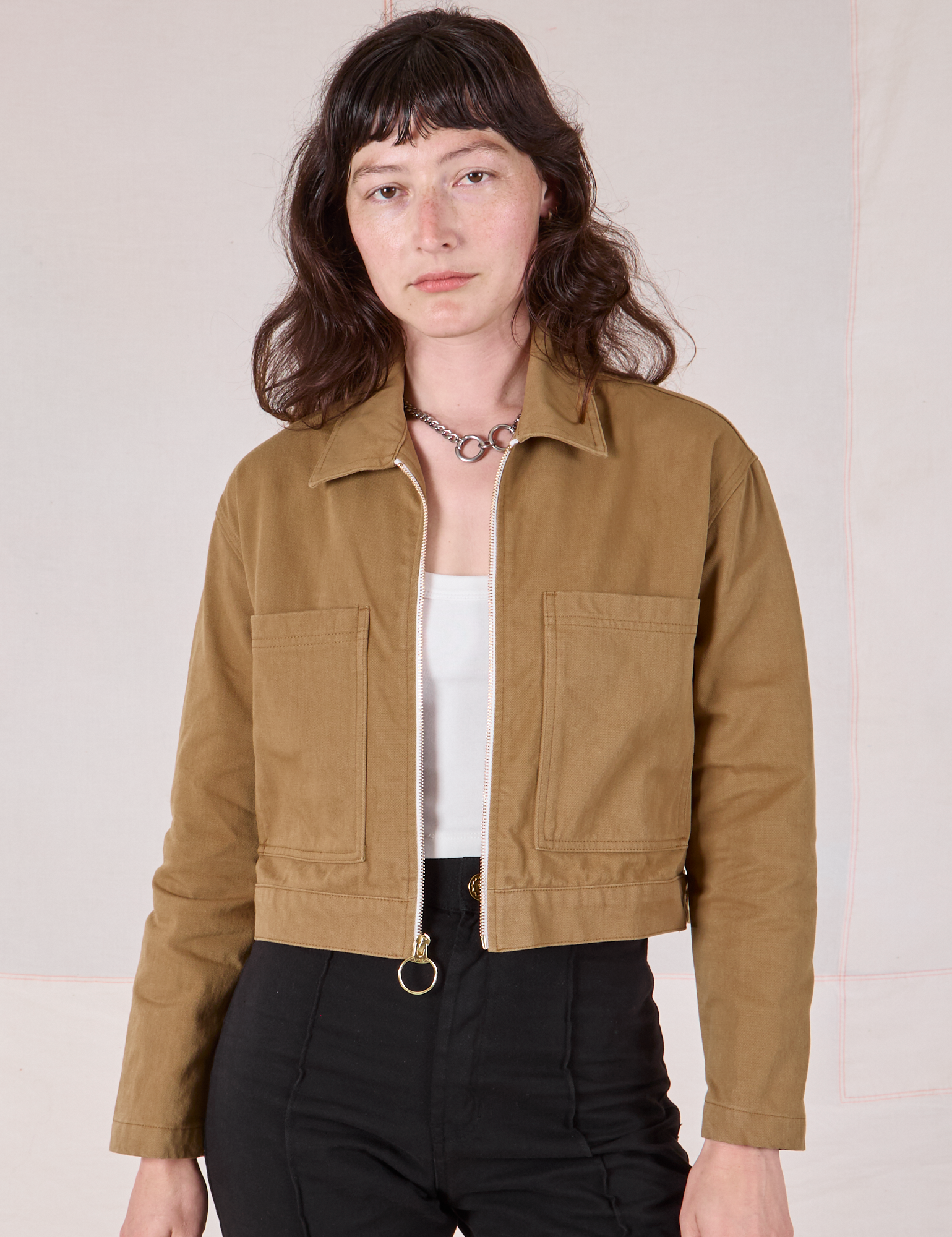 Alex is 5’8” and wearing P Mechanic Jacket in Desert Brown