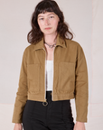 Alex is 5’8” and wearing P Mechanic Jacket in Desert Brown