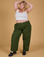 Juliet is 5'7" and wearing 1XL Baggy Mid-Rise Trousers in Evergreen