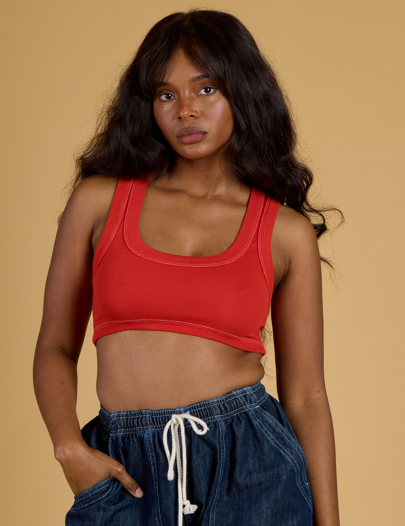Kandia is 5’3” and wearing P Contrast Stitch Mini Tank in Mustang Red