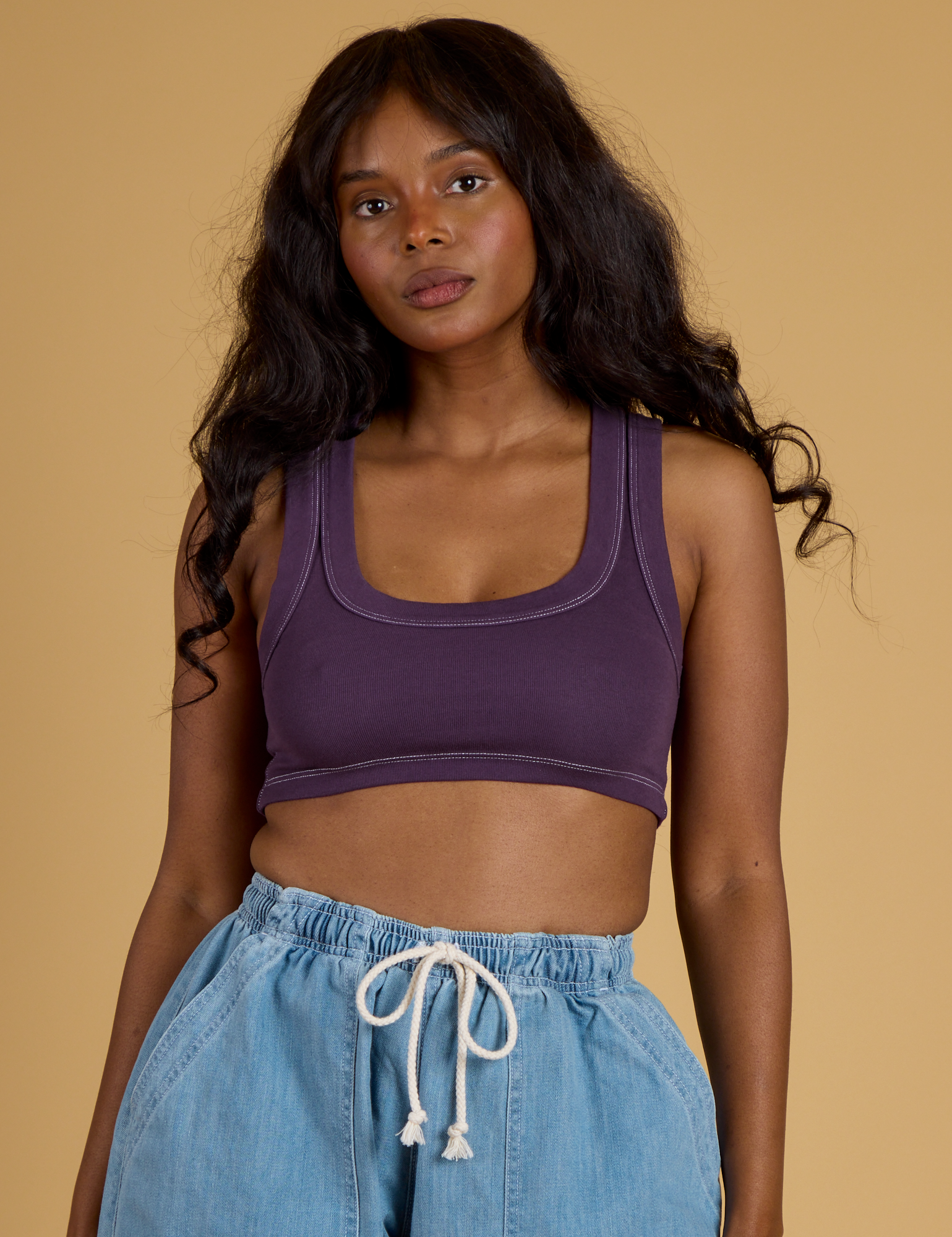 Kandia is 5’3” and wearing P Contrast Stitch Mini Tank in Nebula Purple