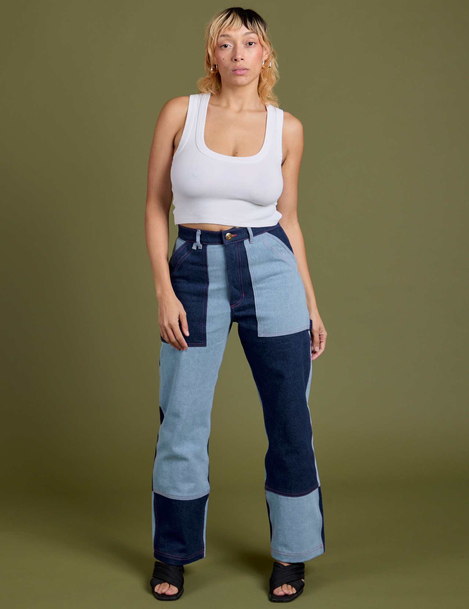 Tiara is 5'4" and wearing S Mismatched Denim Carpenter Jeans paired with a Cropped Tank in Vintage Tee White