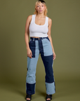 Tiara is 5'4" and wearing S Mismatched Denim Carpenter Jeans paired with a Cropped Tank in Vintage Tee White