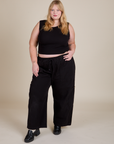 Juliet is 5'7" and wearing L Muscle Tee in Basic Black paired with black Drop Pocket Cargo Pants