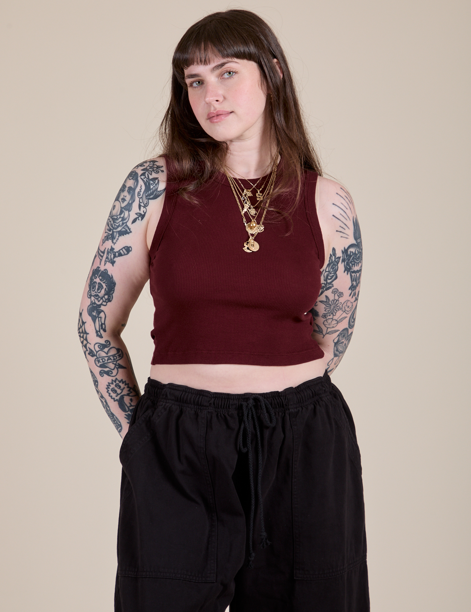 Sydney is 5'9" and wearing XXS Muscle Tee in Red Wine