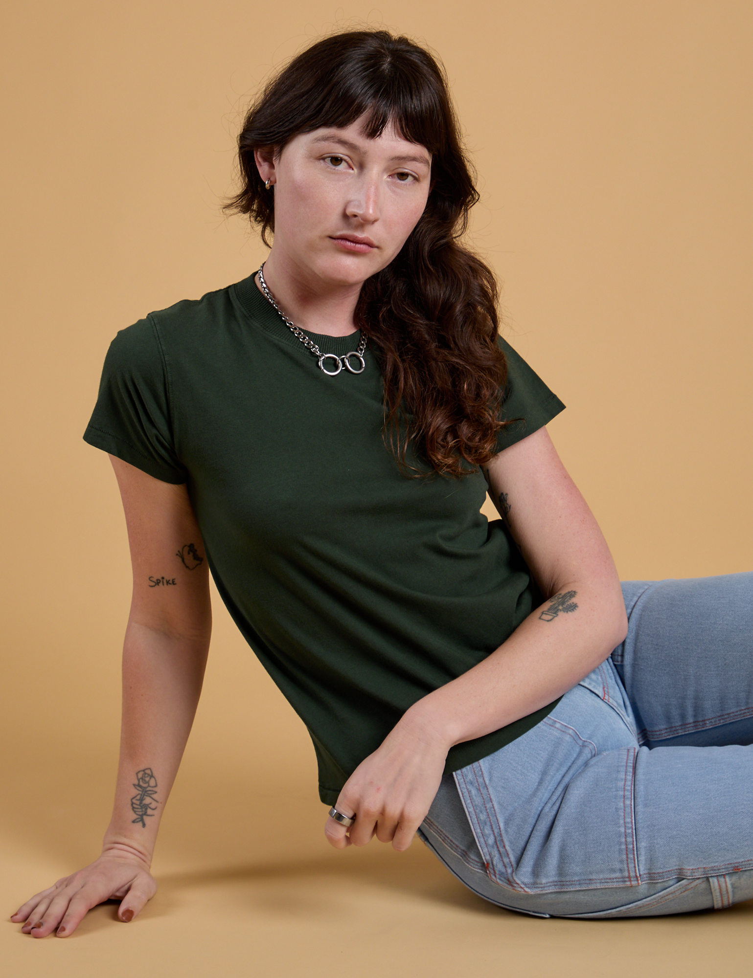 Alex is wearing Organic Vintage Tee in Swamp Green