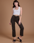 Alex is 5'8" and wearing XXS Organic Work Pants in Espresso Brown paired with vintage tee white Cropped Tank