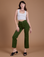 Alex is 5'8" and wearing XXS Organic Work Pants in Evergreen paired with a vintage tee white Cropped Tank