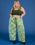 Juliet is 5’7” and wearing 2XL Drop Pocket Cargo Pants in Spring Quilt Print paired with evergreen Mini Tank