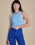 Alex is 5’8” and wearing P Racerback Tank in Baby Blue
