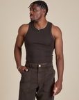 Isaac is 5’10” and wearing S Racerback Tank in Espresso Brown