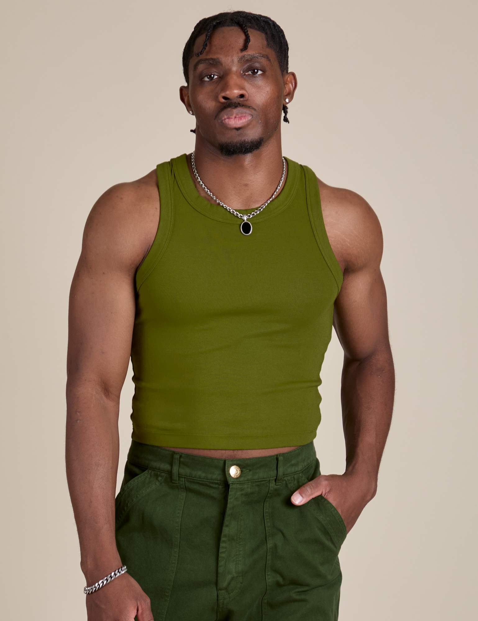 Isaac is 5’10” and wearing S Racerback Tank in Summer Olive