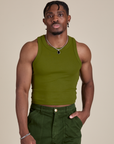 Isaac is 5’10” and wearing S Racerback Tank in Summer Olive