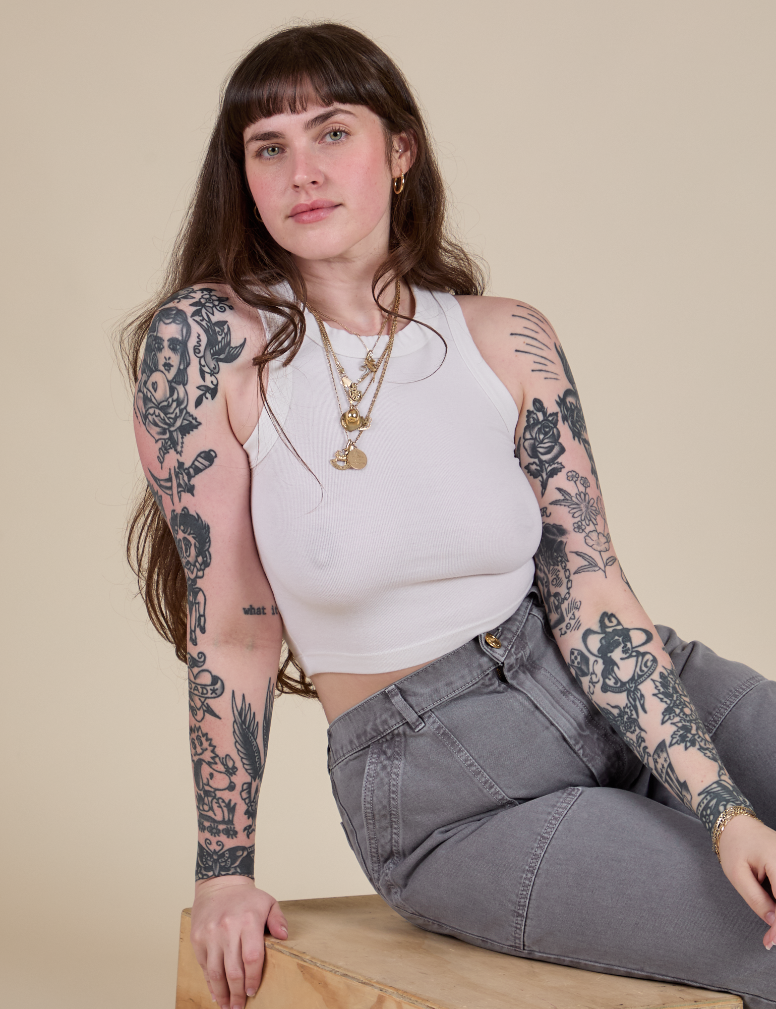 Sydney is wearing Racerback Tank in Vintage Tee White