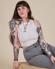 Sydney is wearing Racerback Tank in Vintage Tee White
