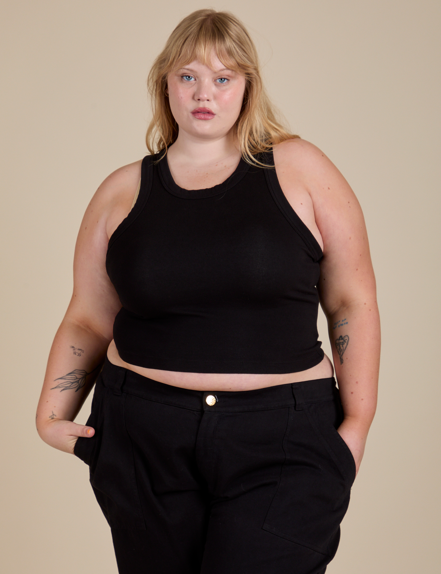 Juliet is 5’7” and wearing L Racerback Tank in Black
