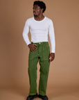 Isaac is 5’10” and wearing M Railroad Denim Work Pants in Gross Green Overdye paired with vintage tee white Long Sleeve Baby Tee