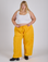Juliet is 5’7” and wearing 2XL Drop Pocket Cargo Pants in Sunshine Yellow paired with a Cropped Tank in Vintage Tee White