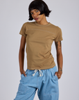 Kira is 5’10” and wearing P  Jr. Varsity Tee in Desert Brown