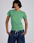 Kira is 5’10” and wearing P Jr. Varsity Tee in Seafoam Green