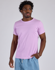 Isaac is 5’10” and wearing M Jr. Varsity Tee in Lilac Purple