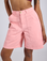 Close up of Longline Work Shorts in Baby Pink on Kira