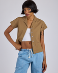 Kira is 5’10” and wearing P Pantry Button-Up in Desert Brown