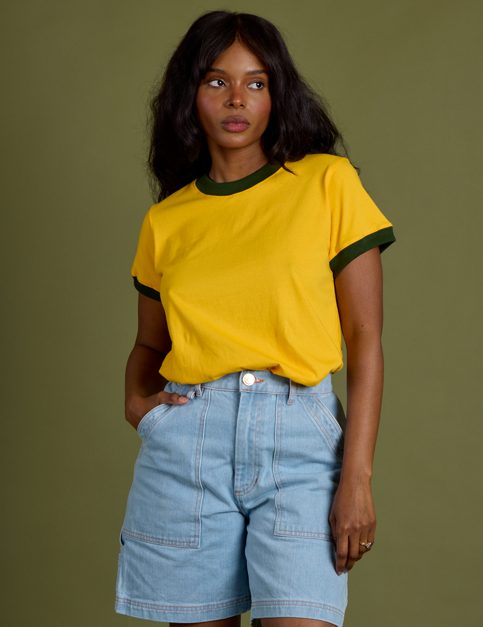 Kandia is 5’3” and wearing P Vintage Ringer Tee in Sunshine Yellow
