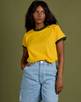 Kandia is 5’3” and wearing P Vintage Ringer Tee in Sunshine Yellow