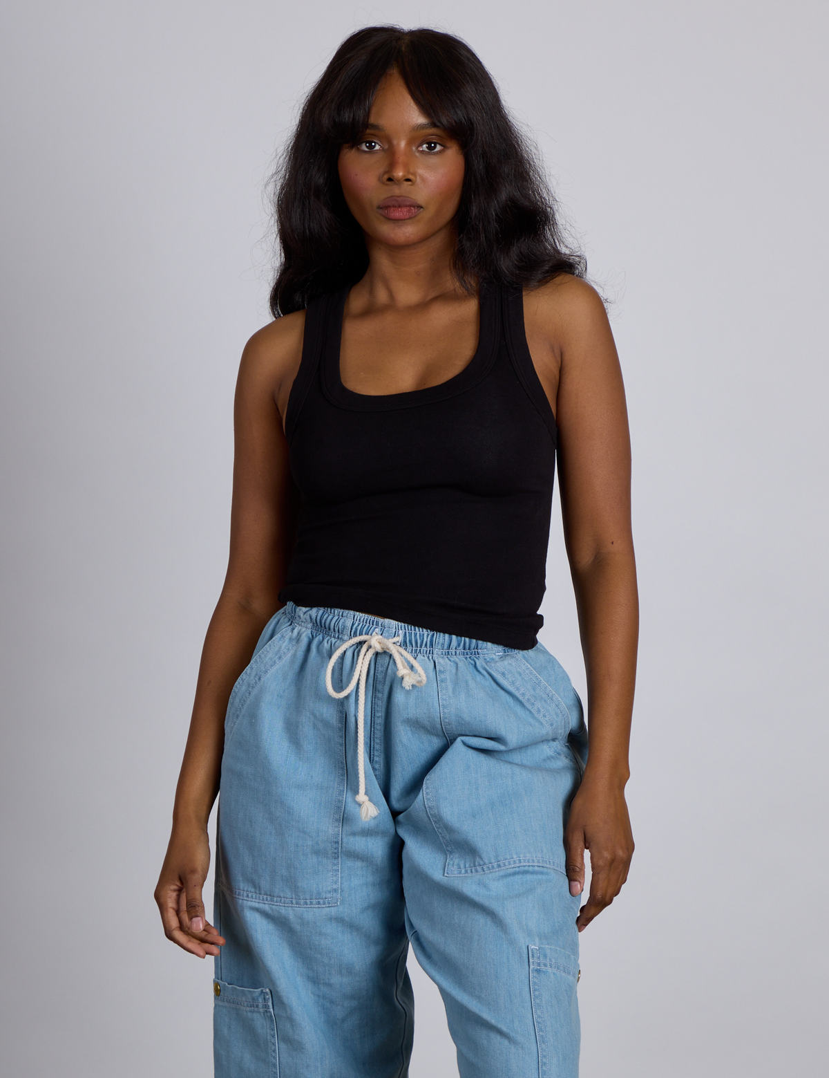 Kandia is 5’4” and wearing P The Tank Top in Basic Black
