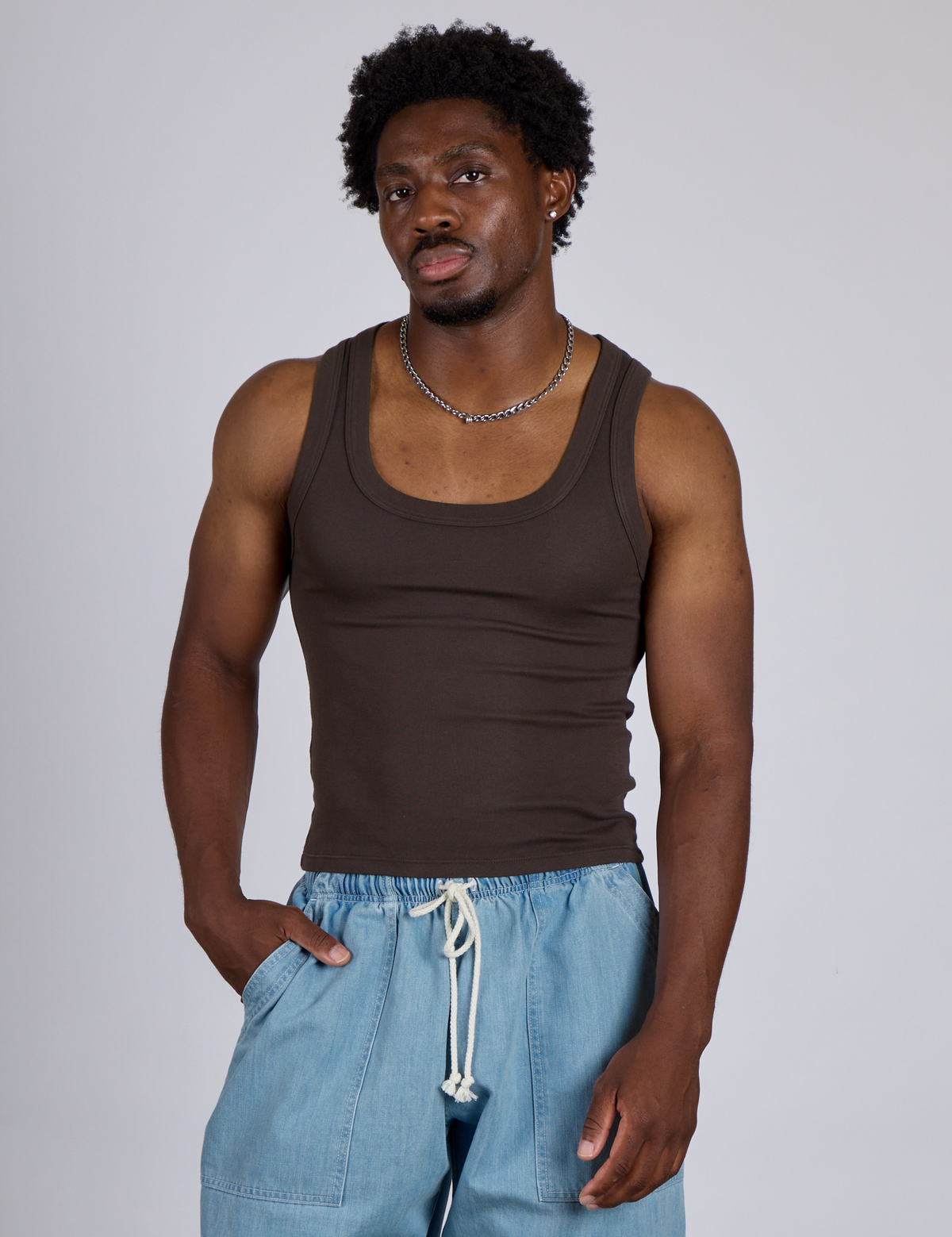 Isaac is 5’10” and wearing M The Tank Top in Espresso Brown
